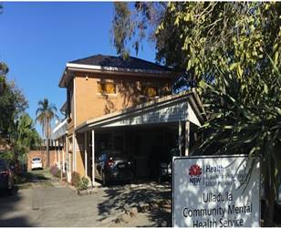 A building with a sign in front of it

Description automatically generated with medium confidence