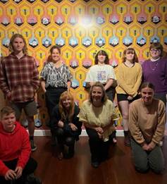 A group of people posing for a photo

Description automatically generated