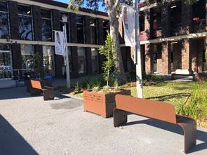 Benches in front of a building

Description automatically generated with low confidence