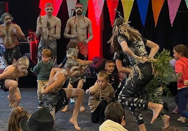 A group of people dancing

Description automatically generated with medium confidence