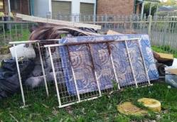 A picture containing grass, outdoor, building, trash

Description automatically generated