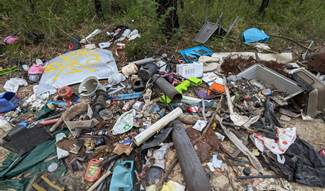 A picture containing outdoor, litter, pollution, scrap

Description automatically generated