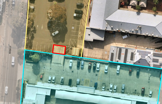 Aerial view of a parking lot

Description automatically generated