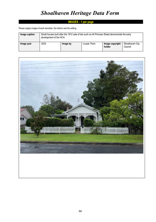 A white house with a fence and trees

Description automatically generated