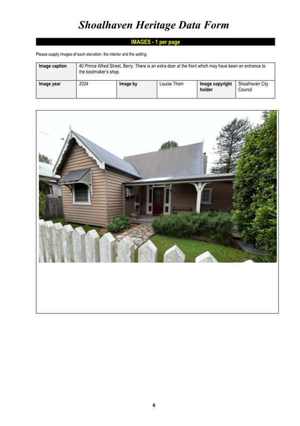 A house with a fence and bushes

Description automatically generated