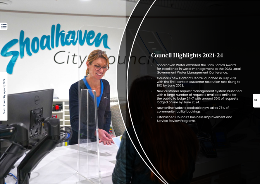 A person standing at a desk

Description automatically generated