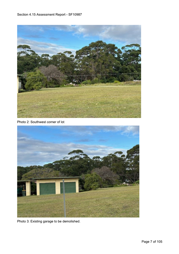 A grass field with trees and a building

Description automatically generated