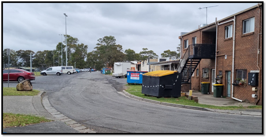 A street with buildings and a fire escape

AI-generated content may be incorrect.
