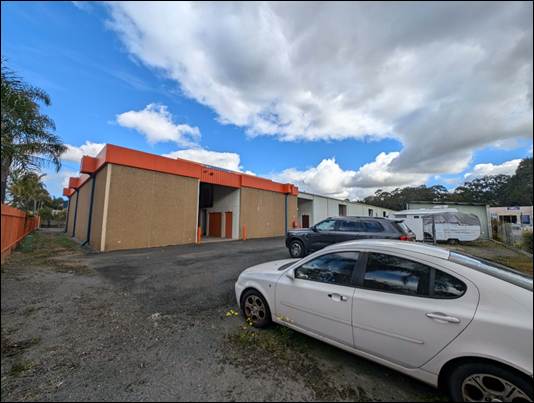 Cars parked cars in front of a building

AI-generated content may be incorrect.